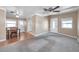 Combined dining and living area with wood and carpet flooring at 4851 W Gandy Blvd # B6 L3, Tampa, FL 33611