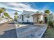 Charming single-wide home with a covered carport and landscaped front yard at 4851 W Gandy Blvd # B6 L3, Tampa, FL 33611