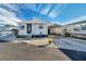Quaint mobile home with carport, landscaping, and paved driveway at 4851 W Gandy Blvd # B6 L3, Tampa, FL 33611