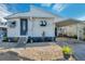 Cute Florida mobile home with carport, landscaping, and paved driveway at 4851 W Gandy Blvd # B6 L3, Tampa, FL 33611