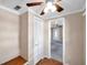 Hallway with ceiling fan, built-in bench, and access to living room at 4851 W Gandy Blvd # B6 L3, Tampa, FL 33611