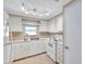 White kitchen with ample counter space and appliances at 4851 W Gandy Blvd # B6 L3, Tampa, FL 33611