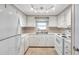 Efficient kitchen with white cabinets and appliances at 4851 W Gandy Blvd # B6 L3, Tampa, FL 33611