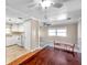 Kitchen and dining area with wood flooring and white cabinets at 4851 W Gandy Blvd # B6 L3, Tampa, FL 33611