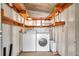 Laundry room with washer, dryer, and shelving at 4851 W Gandy Blvd # B6 L3, Tampa, FL 33611