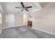 Bright living room with carpeted floors and ceiling fan at 4851 W Gandy Blvd # B6 L3, Tampa, FL 33611