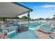 Community pool area with covered seating and lounge chairs at 4851 W Gandy Blvd # B6 L3, Tampa, FL 33611