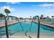 Inviting community pool with ample lounge chairs at 4851 W Gandy Blvd # B6 L3, Tampa, FL 33611