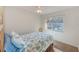 Bright bedroom with a comfortable bed and a view of the neighborhood at 511 Duxbury Ct # C, Safety Harbor, FL 34695