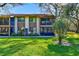 Two-story condo building with screened balconies and landscaping at 511 Duxbury Ct # C, Safety Harbor, FL 34695