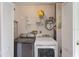 Convenient laundry room with washer, dryer, and shelving at 511 Duxbury Ct # C, Safety Harbor, FL 34695