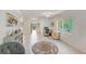 Living room with tile floors, a comfortable seating area, and a home office at 511 Duxbury Ct # C, Safety Harbor, FL 34695