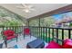 Relaxing screened porch with outdoor furniture and tranquil garden views at 511 Duxbury Ct # C, Safety Harbor, FL 34695