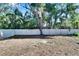 Fenced backyard with large grassy area at 5221 Hillside Meadow Pl, Tampa, FL 33610