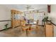 Dining room with glass-top table, wood hutch, and carpeting at 6018 Applegate Dr, Spring Hill, FL 34606