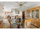 Dining room with a view of the kitchen and a glass-top table at 6018 Applegate Dr, Spring Hill, FL 34606