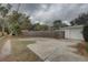 Circular driveway leading to garage and fenced yard at 6056 2Nd N Ave, St Petersburg, FL 33710