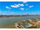 Aerial view of waterfront property with a community pool and marina at 700 Island Way # 704, Clearwater Beach, FL 33767