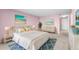 Bright bedroom with king-size bed and water views at 700 Island Way # 704, Clearwater Beach, FL 33767