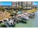 Boat docks with multiple covered slips and a resort-style pool at 700 Island Way # 704, Clearwater Beach, FL 33767