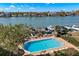 Community pool with ample lounge chairs and waterfront views at 700 Island Way # 704, Clearwater Beach, FL 33767