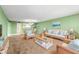 Open living space with wicker furniture and view at 700 Island Way # 704, Clearwater Beach, FL 33767