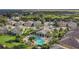 Aerial view of community with pool, clubhouse, and lush landscaping at 7001 Interbay Blvd # 247, Tampa, FL 33616