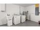 Bright laundry room with washer, dryer, and utility sink at 701 25Th Sw St, Largo, FL 33770