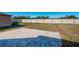 Large backyard with patio and grassy area at 7014 King Creek Dr, Sun City Center, FL 33573