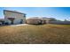 Spacious backyard with grassy area and privacy fence at 7014 King Creek Dr, Sun City Center, FL 33573