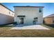 Home features a backyard with patio and grassy area at 7014 King Creek Dr, Sun City Center, FL 33573