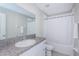 Bathroom with single vanity, tub, and shower at 7014 King Creek Dr, Sun City Center, FL 33573