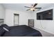 Primary bedroom with large TV and ceiling fan at 7014 King Creek Dr, Sun City Center, FL 33573