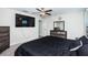 Spacious bedroom with large TV and ample closet space at 7014 King Creek Dr, Sun City Center, FL 33573