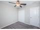 Simple bedroom with ceiling fan and double door closet at 7014 King Creek Dr, Sun City Center, FL 33573