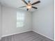 Bright bedroom with ceiling fan and window blinds at 7014 King Creek Dr, Sun City Center, FL 33573