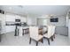 Kitchen with an adjacent dining area, granite countertops, and stainless steel appliances at 7014 King Creek Dr, Sun City Center, FL 33573