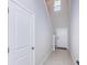Bright and airy entryway with tile flooring, staircase, and coat closet at 7014 King Creek Dr, Sun City Center, FL 33573