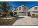 Two-story house with a two-car garage and driveway at 7014 King Creek Dr, Sun City Center, FL 33573