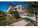 Two-story house with gray siding, two-car garage, landscaping, and driveway at 7014 King Creek Dr, Sun City Center, FL 33573
