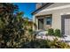 Inviting front entrance with dark green door and nicely landscaped walkway at 7014 King Creek Dr, Sun City Center, FL 33573
