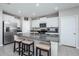 Modern kitchen island with seating and granite countertops at 7014 King Creek Dr, Sun City Center, FL 33573