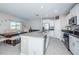 Spacious kitchen with granite countertops, stainless steel appliances, and an island at 7014 King Creek Dr, Sun City Center, FL 33573