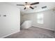 Spacious loft area with ceiling fan and window at 7014 King Creek Dr, Sun City Center, FL 33573