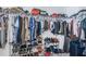 Large walk-in closet with plenty of shelving and rod at 7014 King Creek Dr, Sun City Center, FL 33573