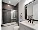 Updated bathroom with walk-in shower and gray vanity at 9152 Warm Springs Cir, Parrish, FL 34219