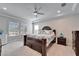 Main bedroom with a king bed, and large windows at 9152 Warm Springs Cir, Parrish, FL 34219