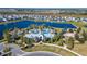 Aerial view of community with lake, pool, and playground at 9152 Warm Springs Cir, Parrish, FL 34219