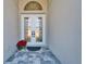 Double front doors with glass inserts and decorative accents at 9152 Warm Springs Cir, Parrish, FL 34219