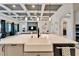 Modern kitchen with a large island and farmhouse sink at 9152 Warm Springs Cir, Parrish, FL 34219